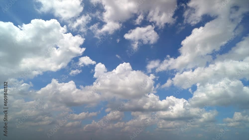 Timelapse of Cumulus white clouds floating on blue sky in beautiful morning Timelapse of Cumulus white clouds floating on blue sky in beautiful morning