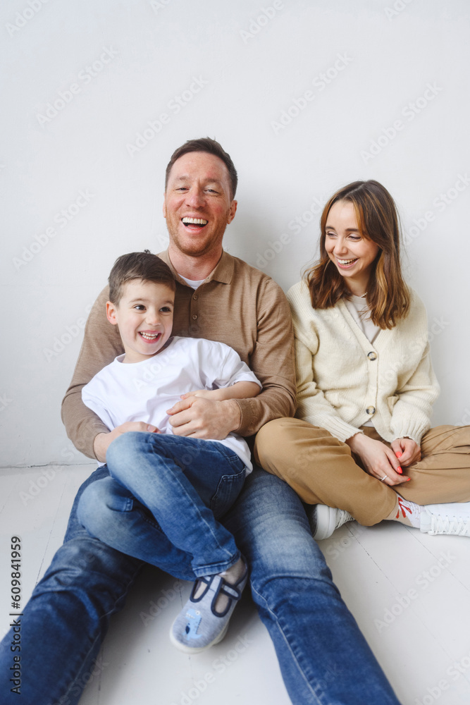 Family with son sitting on floor Family with son sitting on floor