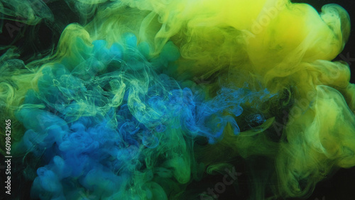 Color smoke. Paint water mix. Toxic fume. Chemical explosion. Green blue mist cloud blend floating on dark black abstract art background.