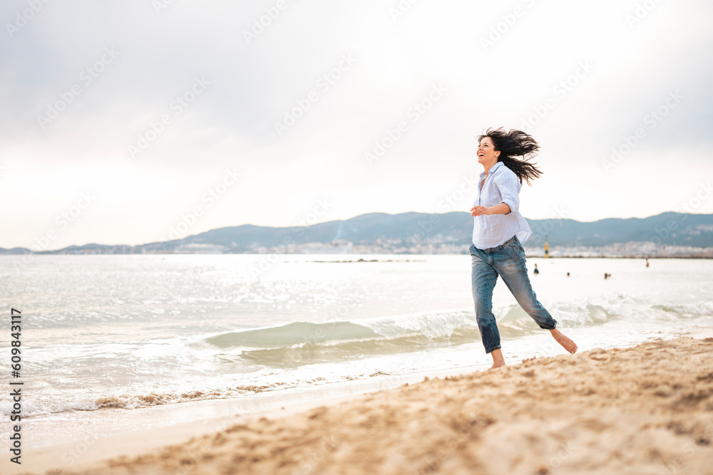 Playful woman spending vacation near sea at beach Playful woman spending vacation near sea at beach