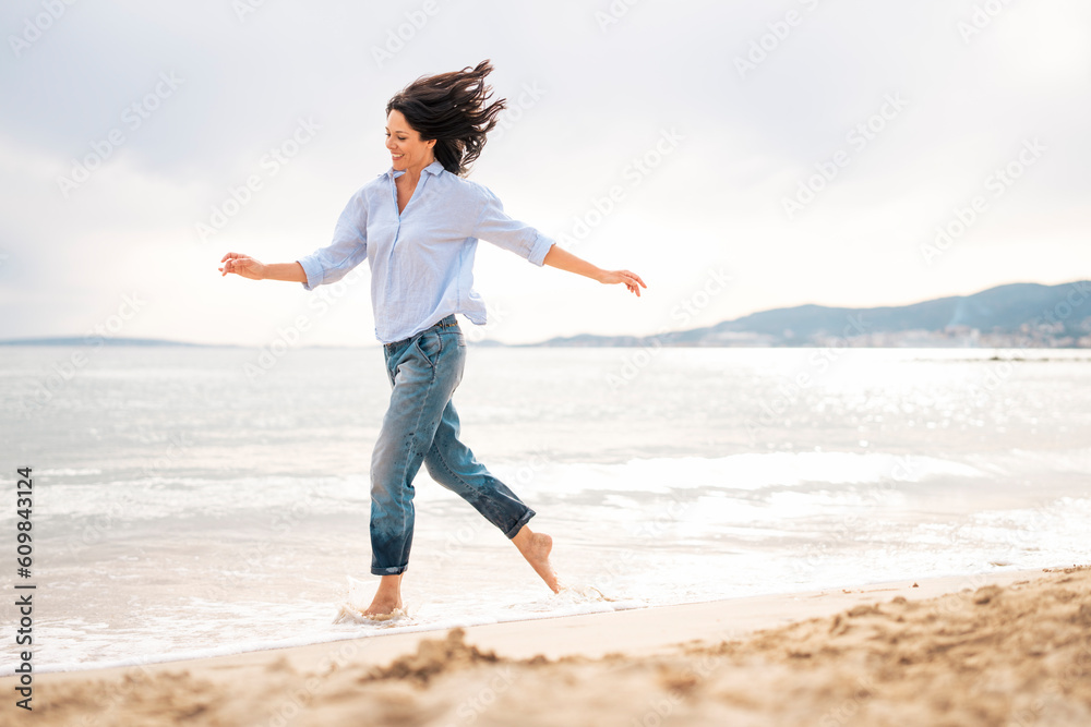 Playful woman enjoying beach holiday at sunny day Playful woman enjoying beach holiday at sunny day