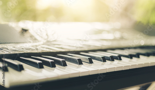 Piano keyboard background was set up in the music room by the windows in the morning to allow the pianist to rehearse before the classical piano performance in celebration of the great success.