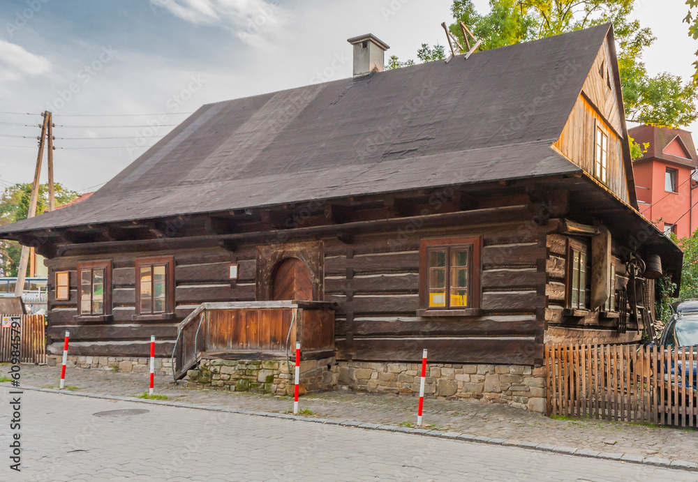 Wooden traditional highlander's hut, which houses the ethnographic museum Stara Zagroda in Ustroń in the Silesian Beskids (Poland). - obrazy, fototapety, plakaty 