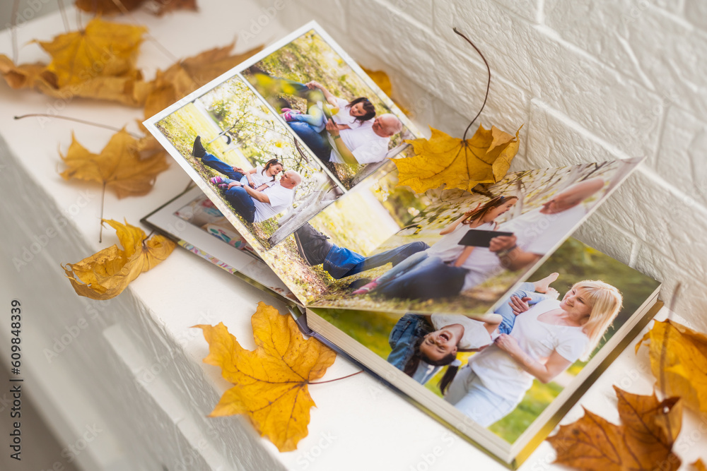 dry autumn leaves and a photo album dry autumn leaves and a photo album