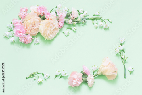 beautiful spring flowers on green background