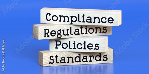 Foto Compliance, regulations, policies, standards - words on wooden blocks - 3D illus