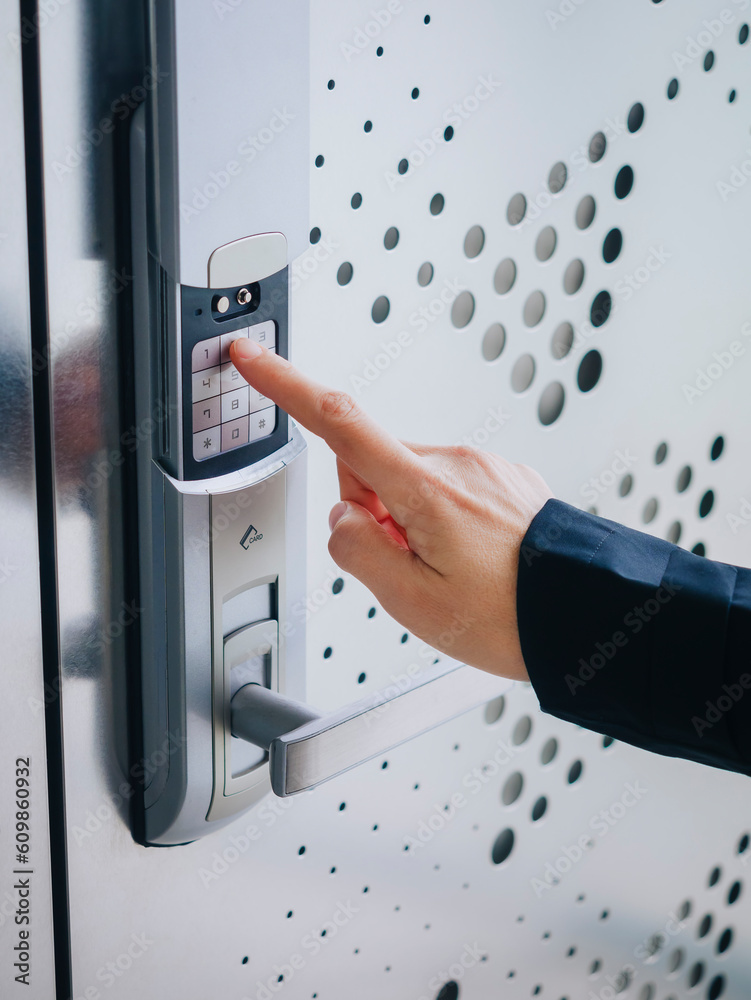 People hand touch on Keypad Digital door lock Security code Modern metal pattern People hand touch on Keypad Digital door lock Security code Modern metal pattern