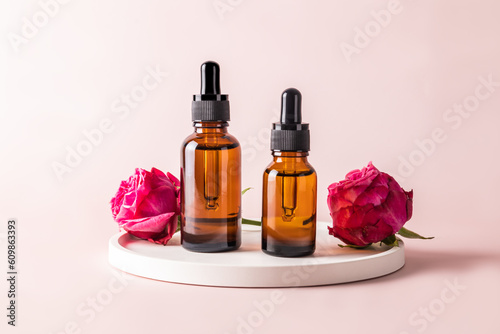 Moisturizing oil fluid for the face with the extract of rose petals for facial skin care. natural self-care. Front view of two bottles.