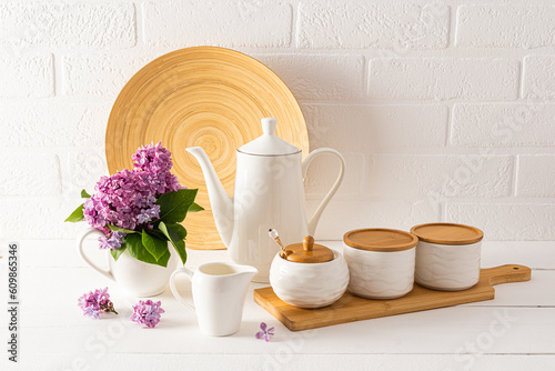 Eco-friendly items and utensils on a modern stylish countertop against a white brick wall. The concept of a cozy home without waste.