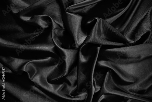 Black silk satin texture background.