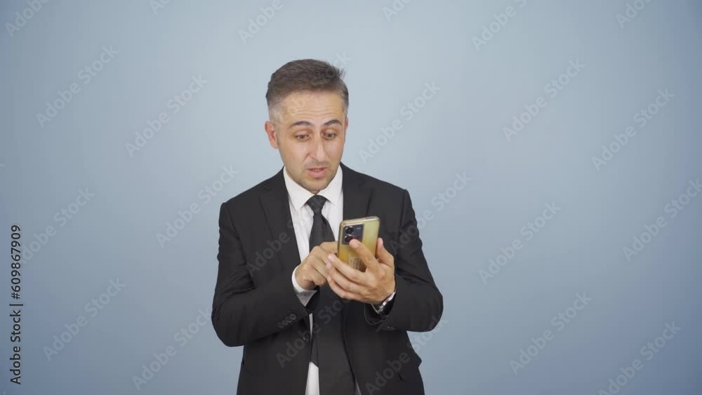 Businessman shopping on the phone with a credit card. Businessman shopping on the phone with a credit card.