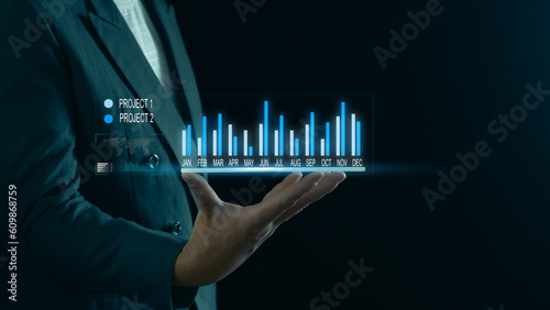 Businessman hands holding graphs, charts, growing business and projects, business finance, strategy development, investment information, business planning, business concept and professional planning.
