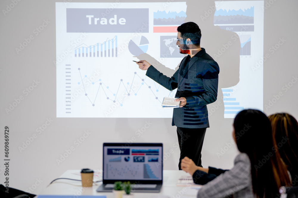 Business man look like lbgt style present about the project in meeting room and coworkers express happy and enjoy the presentation. Business man look like lbgt style present about the project in meeting room and coworkers express happy and enjoy the presentation.