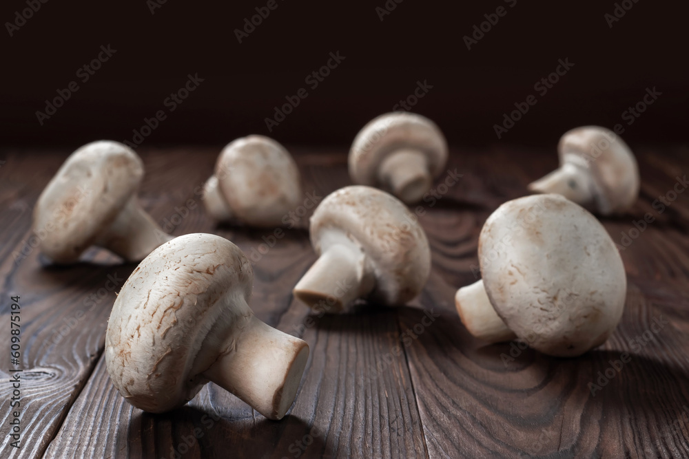 porcini champignon mushrooms on a wooden background close-up porcini champignon mushrooms on a wooden background close-up