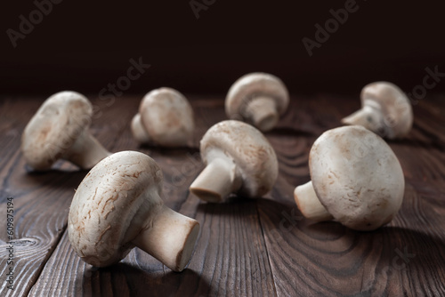 porcini champignon mushrooms on a wooden background close-up