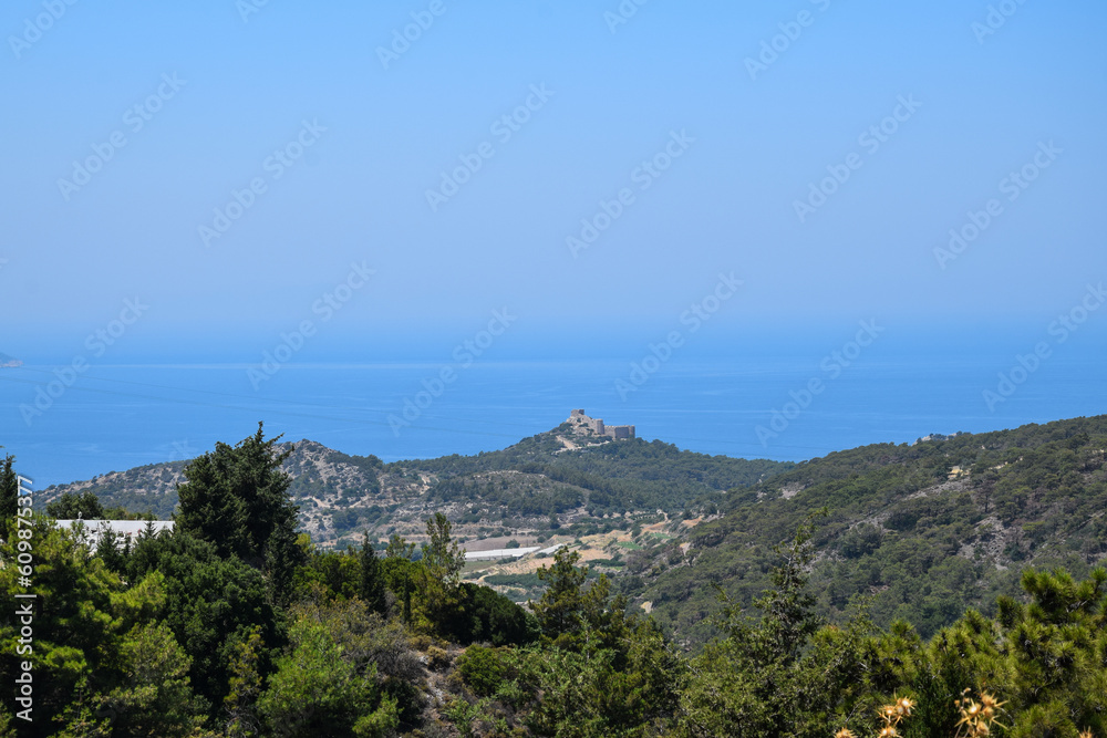 sea view on a clear summer day full of sun. Panorama of the island of Rhodes.