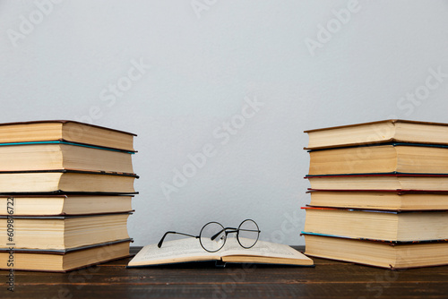 Glasses and books on the table. Concept teacher's day, study, reading, literature, development.