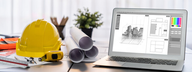 Digital blueprint by architecture design software on laptop screen with documents and blueprint layout on office table seamless integration of technology and traditional drafting method. Insight