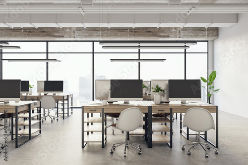 Front view of modern office interior with big window and desks with computers. 3D Rendering