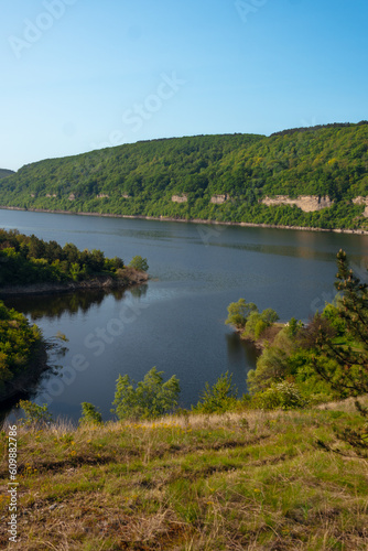 Canyon with the river Dniester on an summer day near the village of Subich. Podolsk Tovtry. Beautiful nature landscape. Mountains and forest, Ukraine. Vertical photo. © Sergey