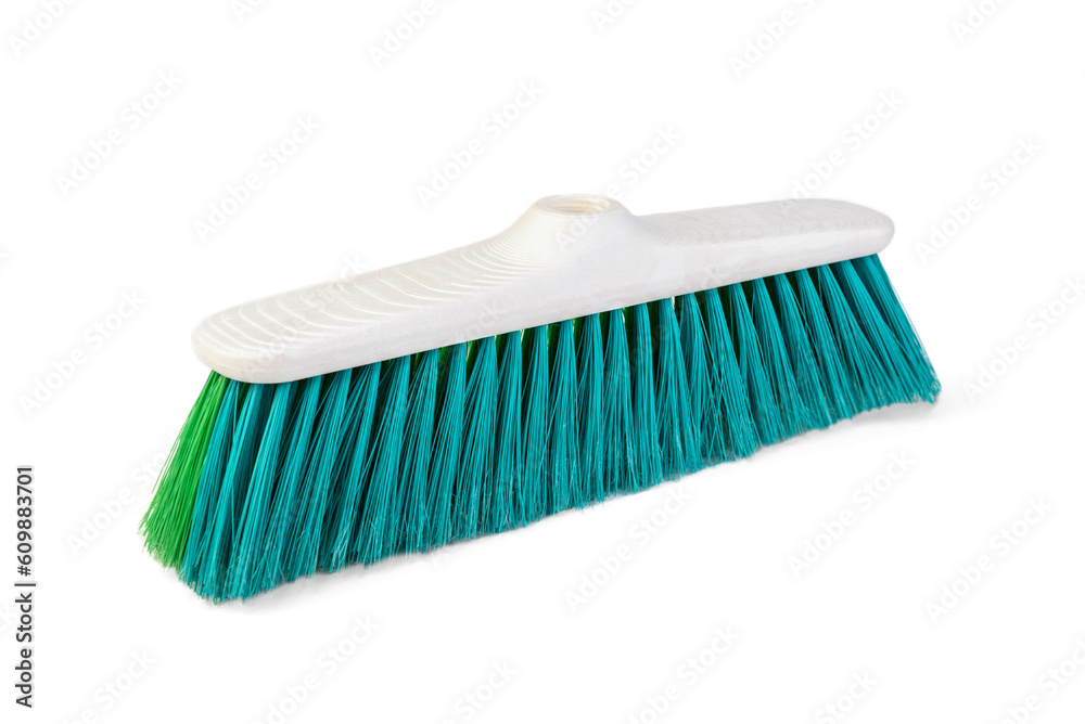 Green stiff outdoor broom on a white background. Cleaning equipment for housework. Green stiff outdoor broom on a white background. Cleaning equipment for housework.