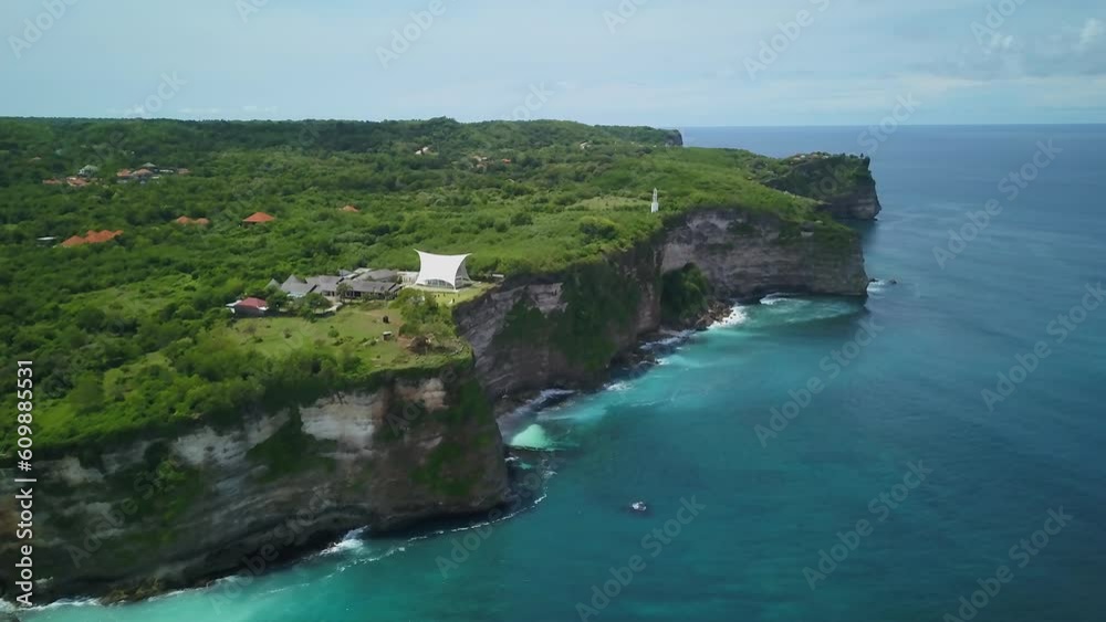 Indo Uluwatu Dreamland Bali aerial cinematic drone Indonesia epic surf reef rugged coastline cliffside jungle aqua deep blue clear water Southeast Asia cave temple waves up forward reveal movement Indo Uluwatu Dreamland Bali aerial cinematic drone Indonesia epic surf reef rugged coastline cliffside jungle aqua deep blue clear water Southeast Asia cave temple waves up forward reveal movement