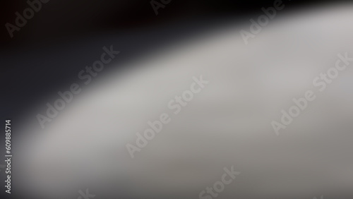 Blurred abstract background, diagonal black and light gray spot.