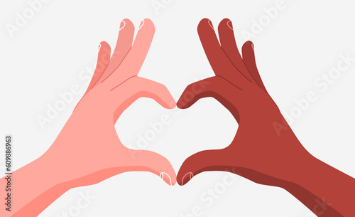 Multiracial hands folded together in a heart shape. The concept of equality and diversity.