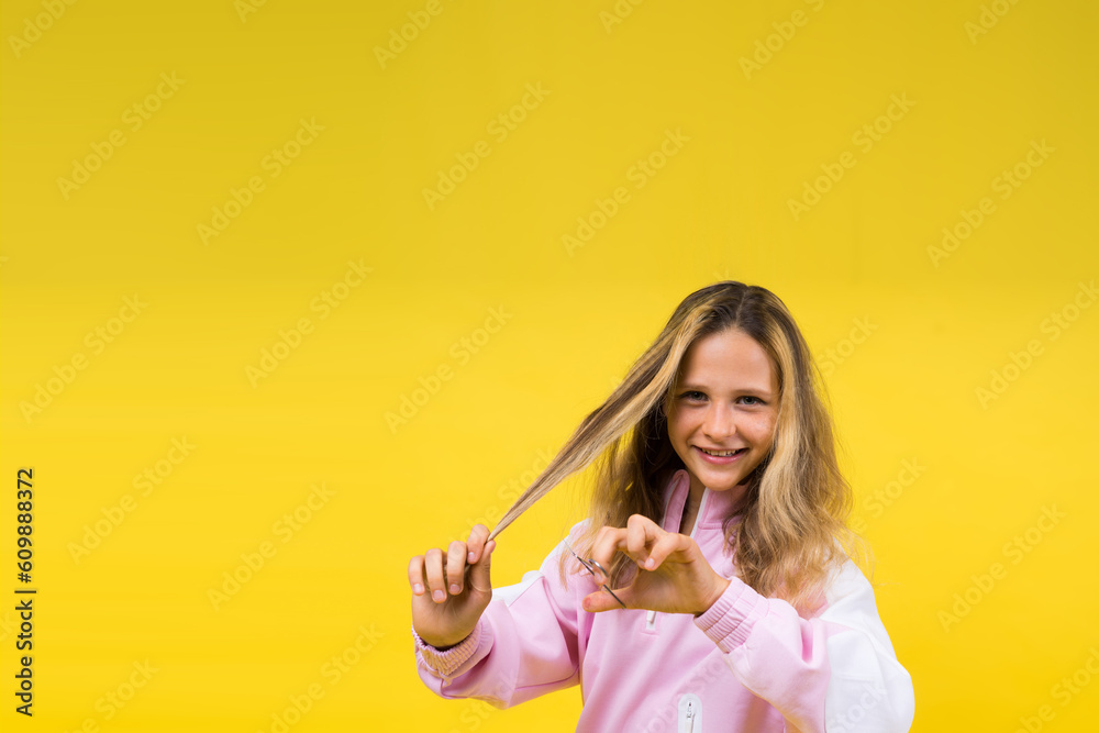 Cheerful kid cut long hair, casual fashion style for beautiful child, girl use hairdresser scissors. Cheerful kid cut long hair, casual fashion style for beautiful child, girl use hairdresser scissors.
