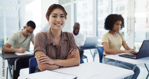 Portrait, education and girl college student in classroom for learning, lecture or studying at academy. Face, woman or happy university learner smile in lecture for future, career development or exam