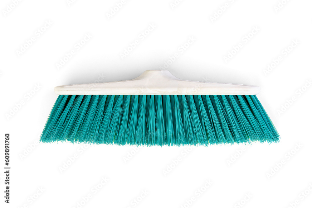 Green stiff outdoor broom on a white background. Cleaning equipment for housework. Top view. Green stiff outdoor broom on a white background. Cleaning equipment for housework. Top view.