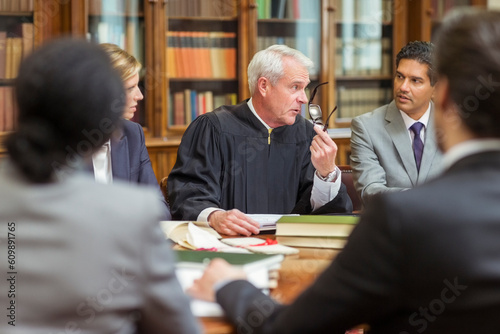 Obraz na płótnie Judge and lawyers talking in chambers