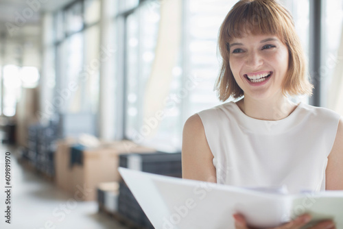 Businesswoman laughing in office