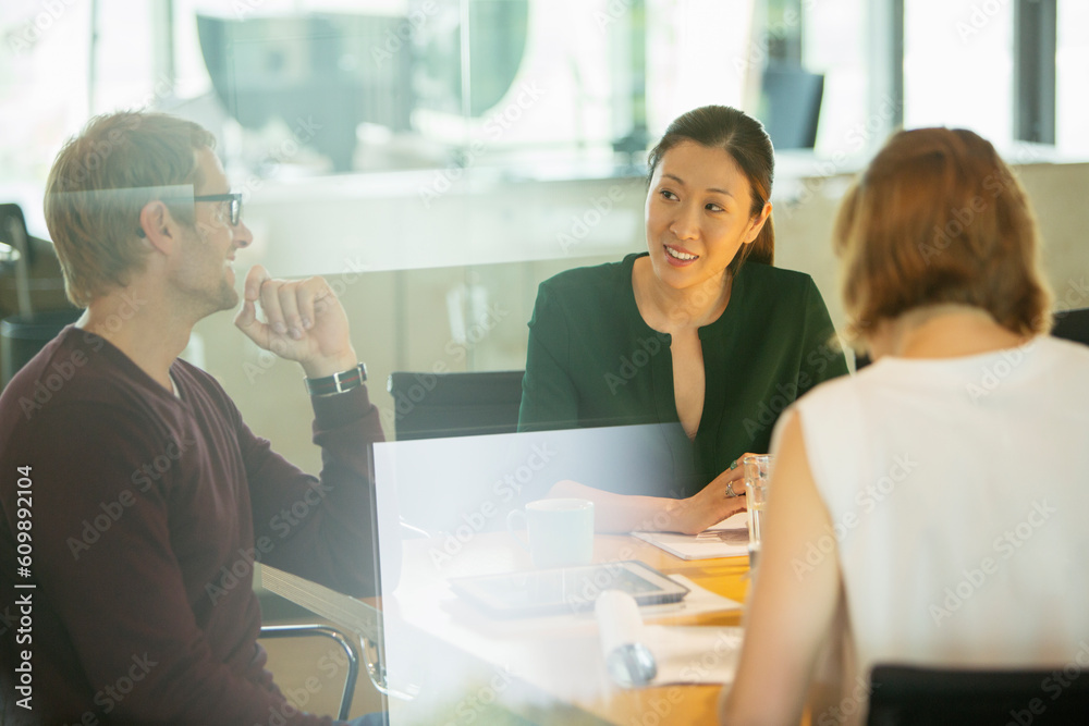 Business people talking in office meeting Business people talking in office meeting