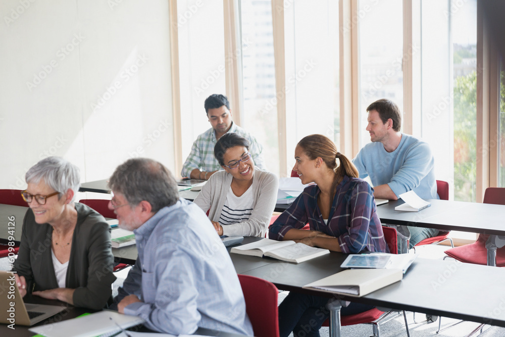 Adult education students working in pairs in classroom Adult education students working in pairs in classroom