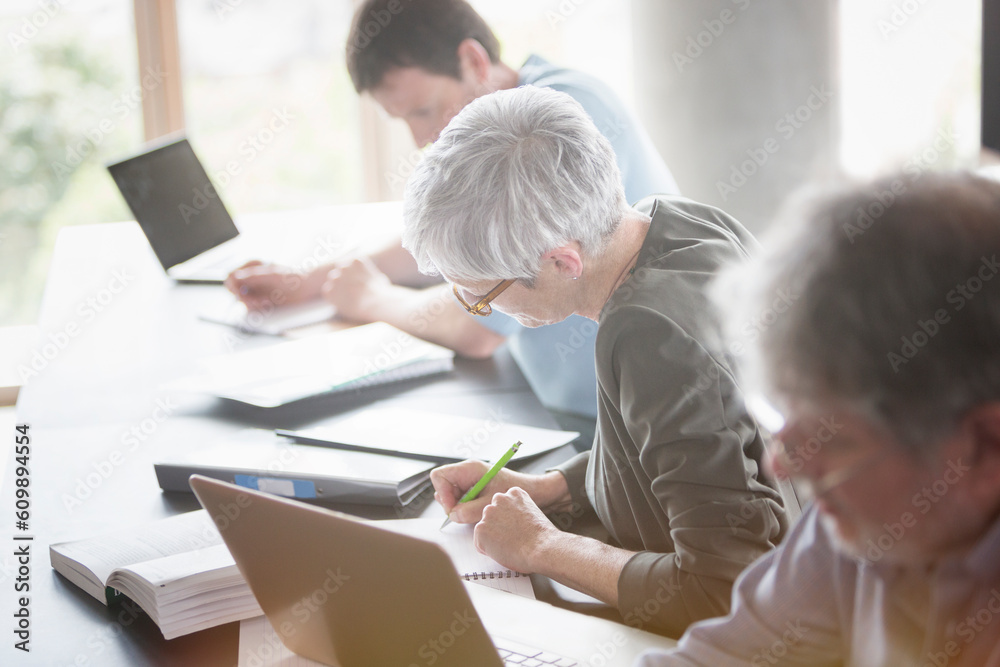 Fototapeta premium Students studying in adult education classroom