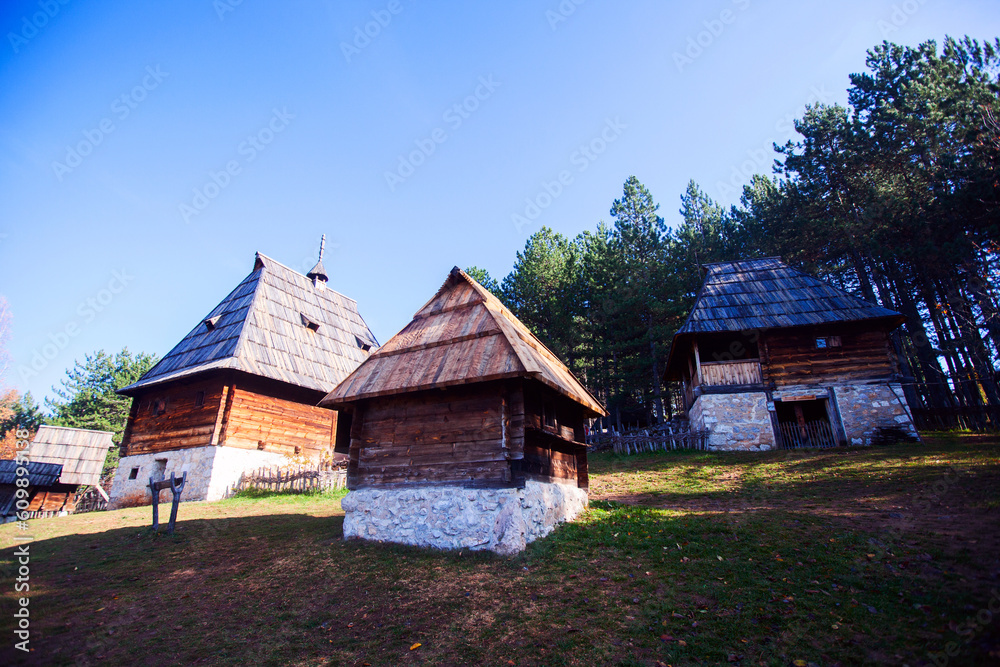 Traditional Serbian rustic wooden houses, in a peaceful village setting, Open-air Museum, cultural heritage, surrounded by nature,  Monument of Culture, Sirogojno, Serbia.
