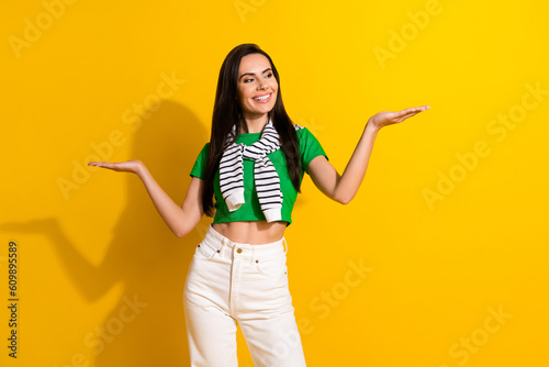 Photo of promoter lady hold two open palms products raise select one higher best cheap choice isolated yellow color background