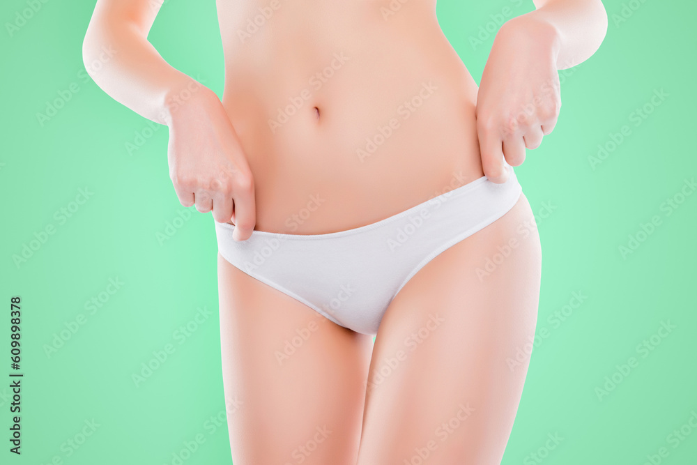 Cropped close up photo of woman's skinny slim thin hips in cotton panties isolated on white background