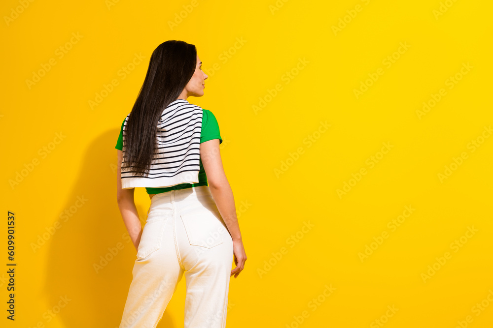 Photo of sexy dreamy girl dressed green t-shirt looking empty space isolated yellow color background Photo of sexy dreamy girl dressed green t-shirt looking empty space isolated yellow color background
