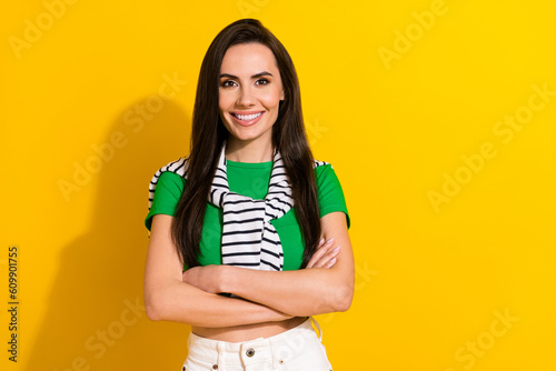 Portrait of young cute lady beaming white teeth smile hold arms crossed wear stylish outfit isolated yellow color background