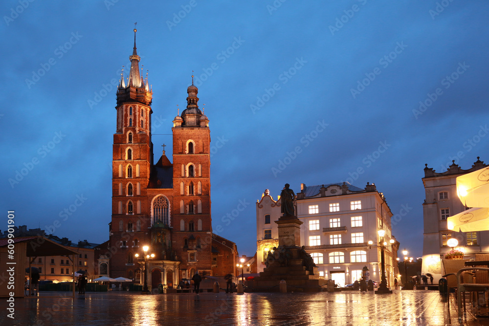 St. Mary's Basilica in the main market square (Rynek Glowny) in evening time in Krakow, Poland