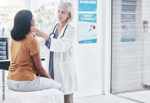 Consulting, thyroid and woman with doctor in hospital for sick, cancer or medical test. Healthcare, medicine and virus with physician and checking throat of patient in clinic for emergency and injury photo