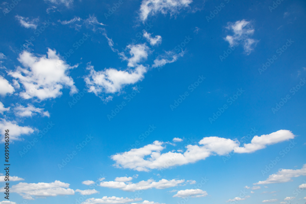 puffy small clouds at a blue sky gives a harmonic background puffy small clouds at a blue sky gives a harmonic background