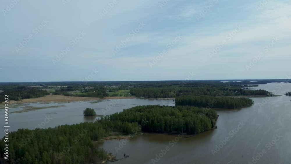 A broad river courses its way, embraced by forests on both banks, while a quaint village finds its place in close proximity. A broad river courses its way, embraced by forests on both banks, while a quaint village finds its place in close proximity.