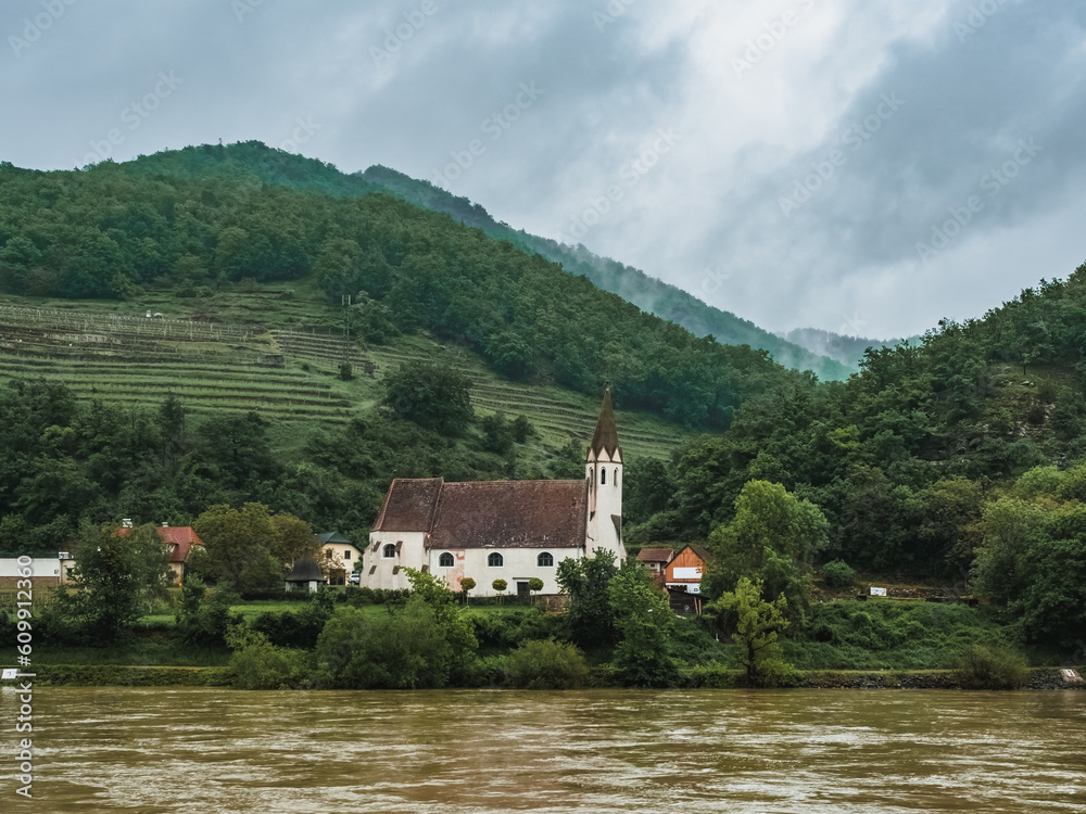Church on the banks of the Danube in the Wachau Valley, Austria. Beautiful church on the river