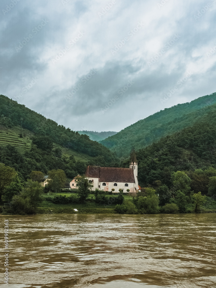 Church on the banks of the Danube in the Wachau Valley, Austria. Beautiful church on the river