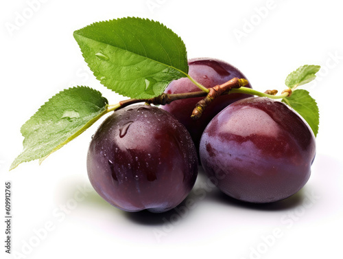 Plums with green leaves isolated on white background