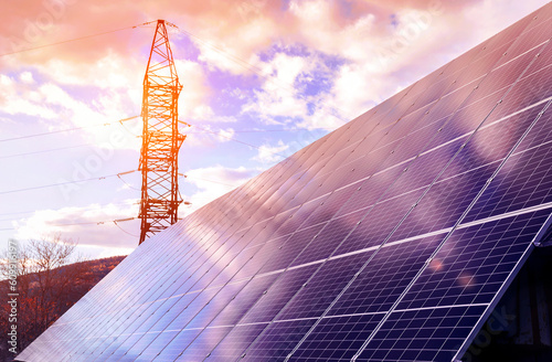 Obraz na płótnie Solar Panels Cells or Photovoltaics  with High Voltage Electric Pylon Pillar Sub
