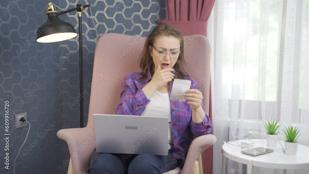 Woman looking at high electricity bill turns off the lights. Woman looking at high electricity bill turns off the lights.